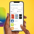 Hand holding smartphone with Worthington Libraries mobile app
