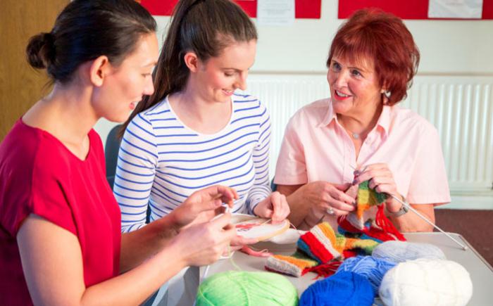 Trio of women knitting and embroidering