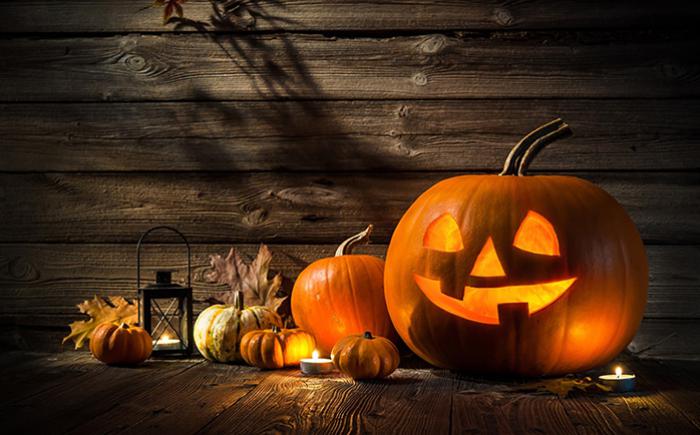 Autumn arrangement of pumpkins, leaves and candles