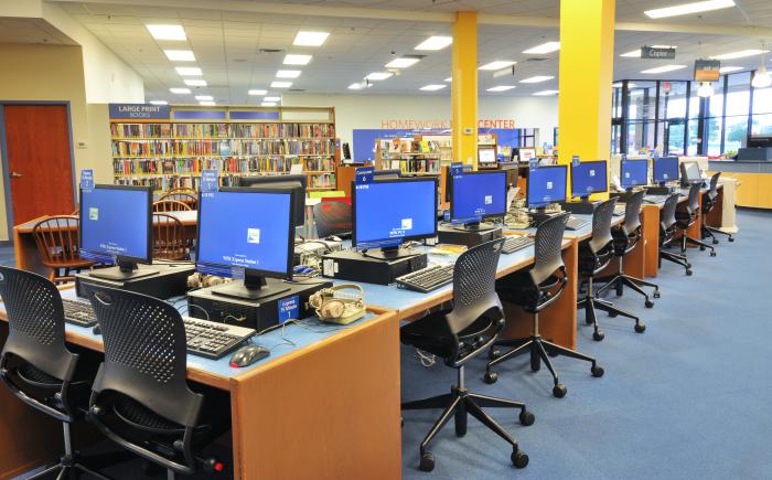 Pictured: row of computers at a library