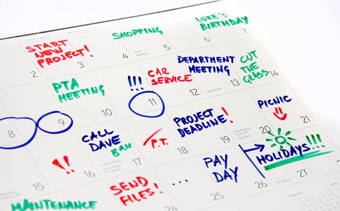 Monthly calendar filled with events in colorful marker