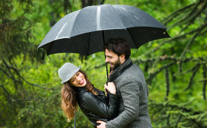 Two adults dancing outdoors