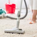 Person vacuuming a carpet