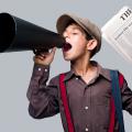 Newspaper boy shouting through megaphone