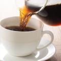 Coffee being poured into a cup
