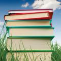 Stack of books in the grass