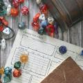Die, character sheet and other items needed to play Dungeons & Dragons