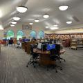 View of computers and bookshelves in the popular library