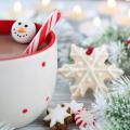 Wintry image of greenery, mug of cocoa and candles