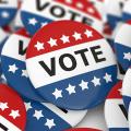Red, white and blue "VOTE" buttons