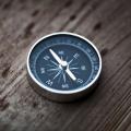 Compass lying on a wood table