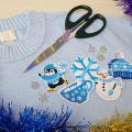 Sweater, scissors and winter-themed decorations