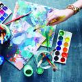 The art process with canvases, brushes and paints