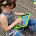 Child with an iPad