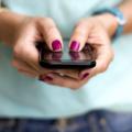 Close-up of a woman texting on her cellphone