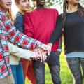 Teens stacking their hands in solidarity