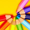 Colored pencils arranged in a half circle