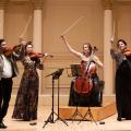Members of Carpe Diem String Quarter in formal wear on stage