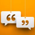 Quotation marks inside speech bubbles against orange background