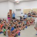 A comedy juggler performing for a crowd