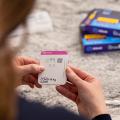 Woman's hands holding COVID-19 at-home test kit