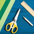Scissors, a pencil, a ruler and construction paper