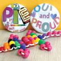 Pride-themed keychain and buttons