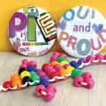 Pride themed buttons and crafts.