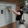 Woman using the pick-up lockers at Old Worthington Library