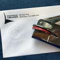 Notary embosser