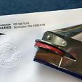 Notary embosser next to a Worthington Libraries logo