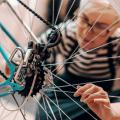 Woman examining a bicycle tire