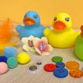 Rubber ducks, buttons, pom poms and other supplies