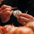 Female hands painting eggs