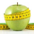 Apple wrapped in measuring tape