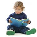 Toddler boy holding a book