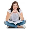 Teenager sitting with a book in her lap