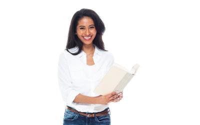 Woman standing with open book in her hands