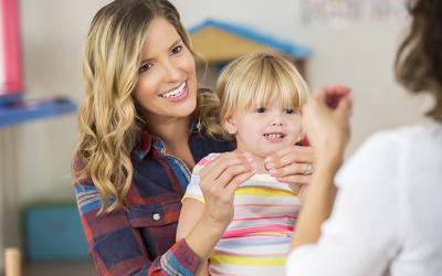 Woman and child practice American Sign Language sign for "more"