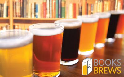 Beer glasses lined up in front of book shelves