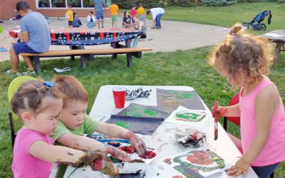 Children painting outdoors