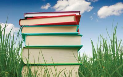 Stack of books in the grass