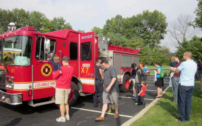Crowd gathered around a fire truck