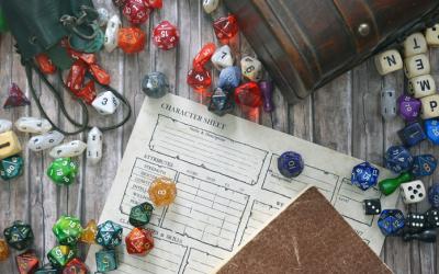 Die, character sheet and other items needed to play Dungeons & Dragons