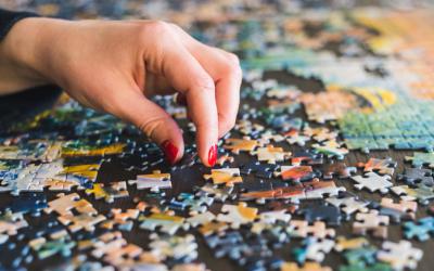 Hand sorting jigsaw puzzle pieces