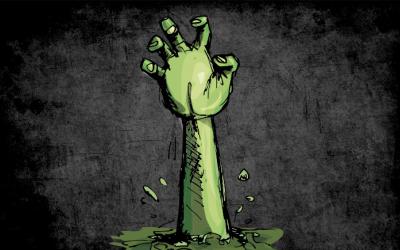 Hand breaking out from underground