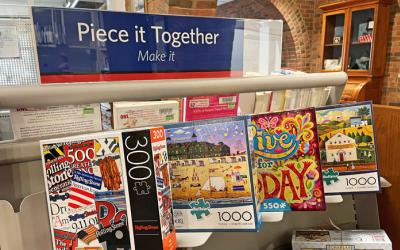 Old Worthington Library's Piece it Together display with jigsaw puzzles