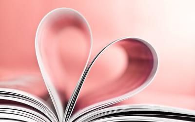 Open book with pages formed in the shape of a heart