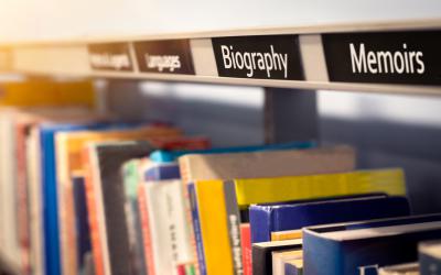 Books on shelf with Biography and Memoirs labels