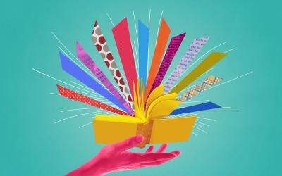 Illustration of hand and floating book with color rays shooting out